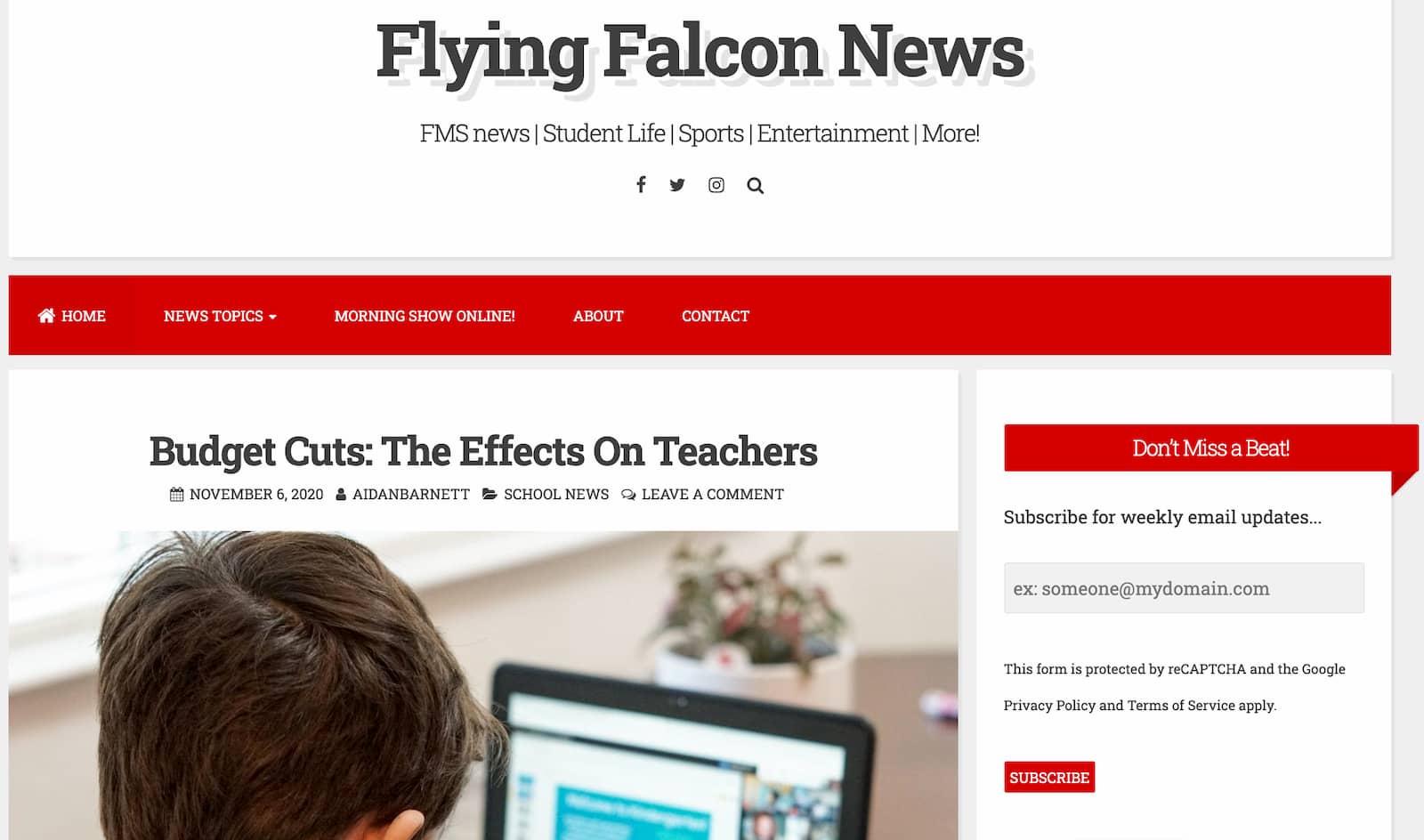 A screenshot of FarnellNews.com website with read headers and featured image of boy student using a latptop.