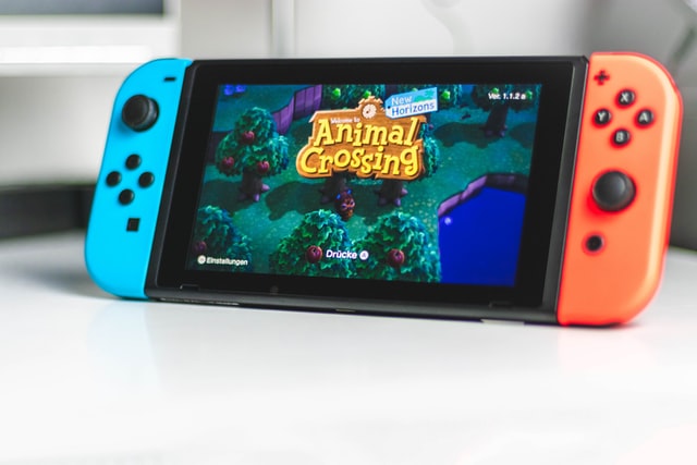 Switch game console with Animal Crossing intro screen.